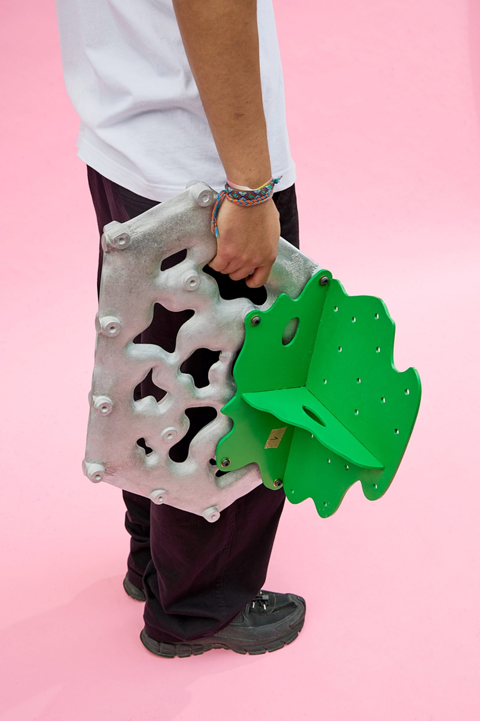 Man holding a metal piece